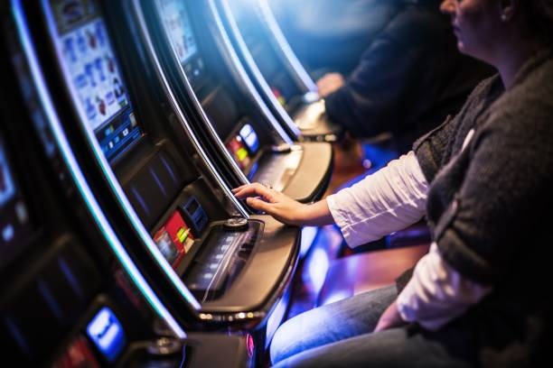 Red Tiger slot game interface showing five reels and stake controls
